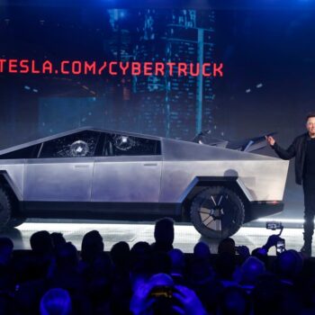 Tesla delivers 13 stainless steel Cybertruck pickups as it tries to work out production problems