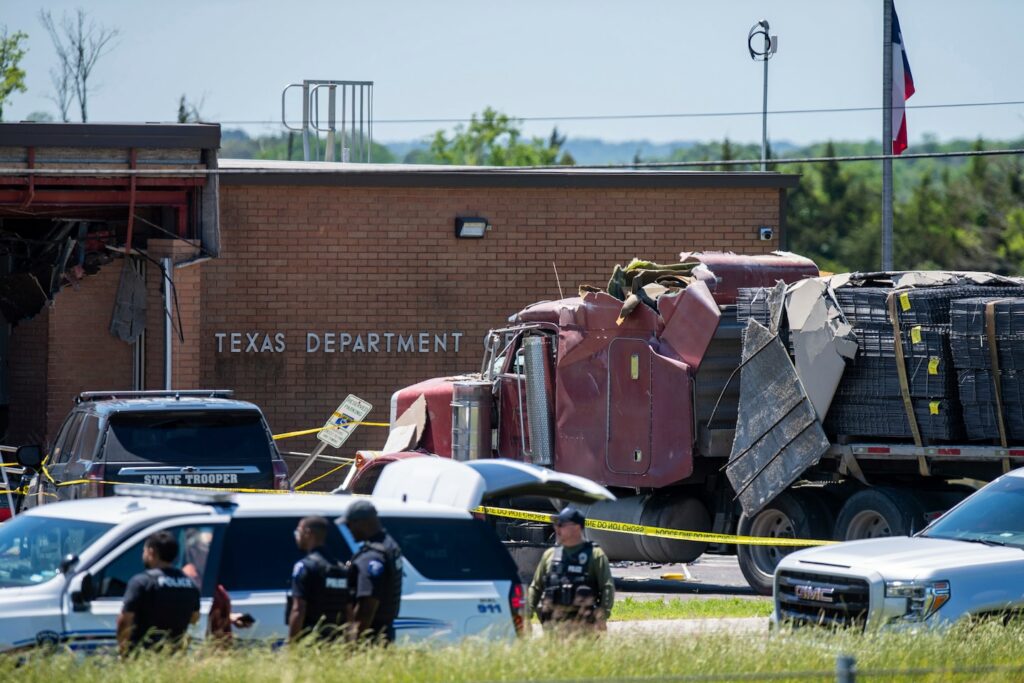 1 killed, 13 hurt after driver rams truck into Tex. state agency, officials say