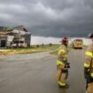 Firefighters assess the damage to houses after a tornado passed through the area near Omaha, Neb., on Friday, April 26, 2024. (Chris Machian/Omaha World-Herald via AP)