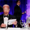 U.S. President Joe Biden reacts as host Colin Jost speaks to him as they, along with White House Correspondents' Association (WHCA) President and NBC News Senior White House Correspondent Kelly O'Donnell, attend the White House Correspondents' Association Dinner in Washington, U.S., April 27, 2024. REUTERS/Tom Brenner