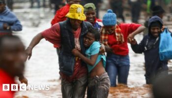 Locals rescue stranded residents who were trapped in their flooded homes in Nairobi