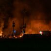 Police experts works at the site where buildings were damaged by a Russian military strike, amid Russia