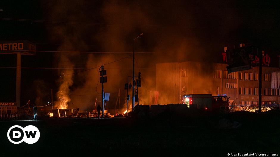 Police experts works at the site where buildings were damaged by a Russian military strike, amid Russia