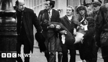 A victim of Bloody Sunday is carried through the streets of Derry