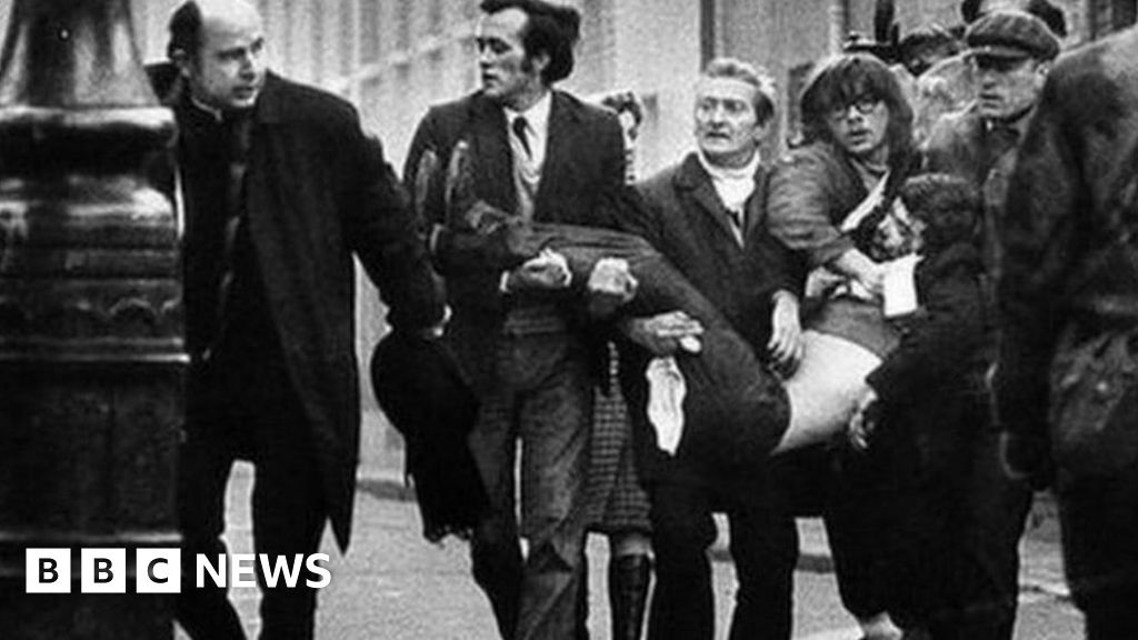 A victim of Bloody Sunday is carried through the streets of Derry