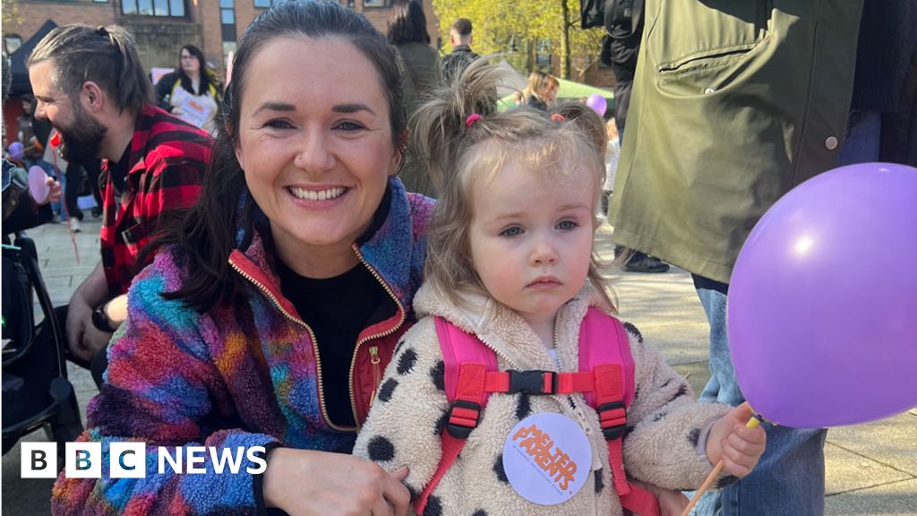 Parent Clare Sloane and daughter at childcare march in Belfast