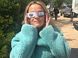Stars look out for the eclipse! Reese Witherspoon, Jessica Biel and Kelly Osbourne lead the celebs trying to catch a glimpse of rare phenomenon