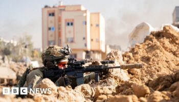 Israeli soldier takes position in the Gaza Strip, amid the ongoing conflict between Israel and the Palestinian Islamist group Hamas,