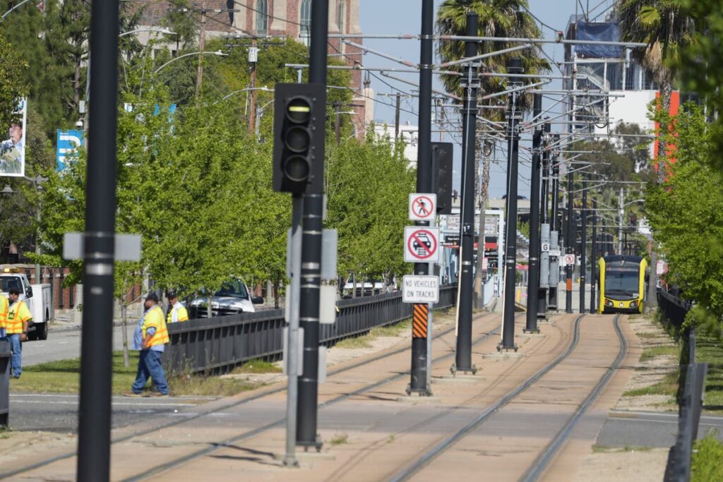 Metro train collides with bus in downtown Los Angeles, injuring more than 50, 2 seriously