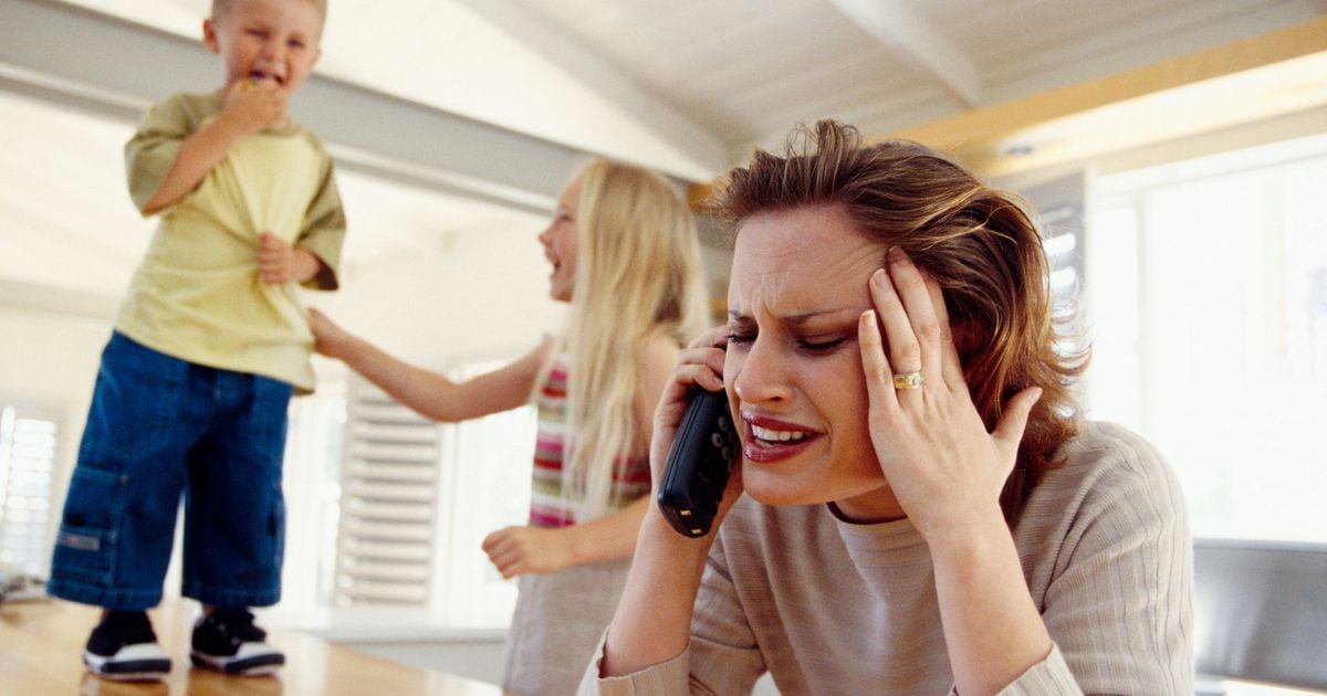 Stressed woman on telephone