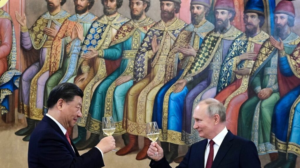 The Russian and Chinese leaders toasting during a dinner last year. Pic: AP