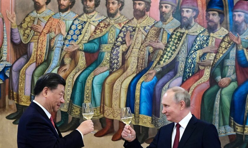 The Russian and Chinese leaders toasting during a dinner last year. Pic: AP