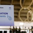 This photograph taken on October 20, 2020 shows a sign reading "naturalisation, informations" ahead of a visit of the French president about the fight against separatism at the Seine Saint Denis prefecture headquarters in Bobigny, near Paris. (Photo by Ludovic MARIN / POOL / AFP)