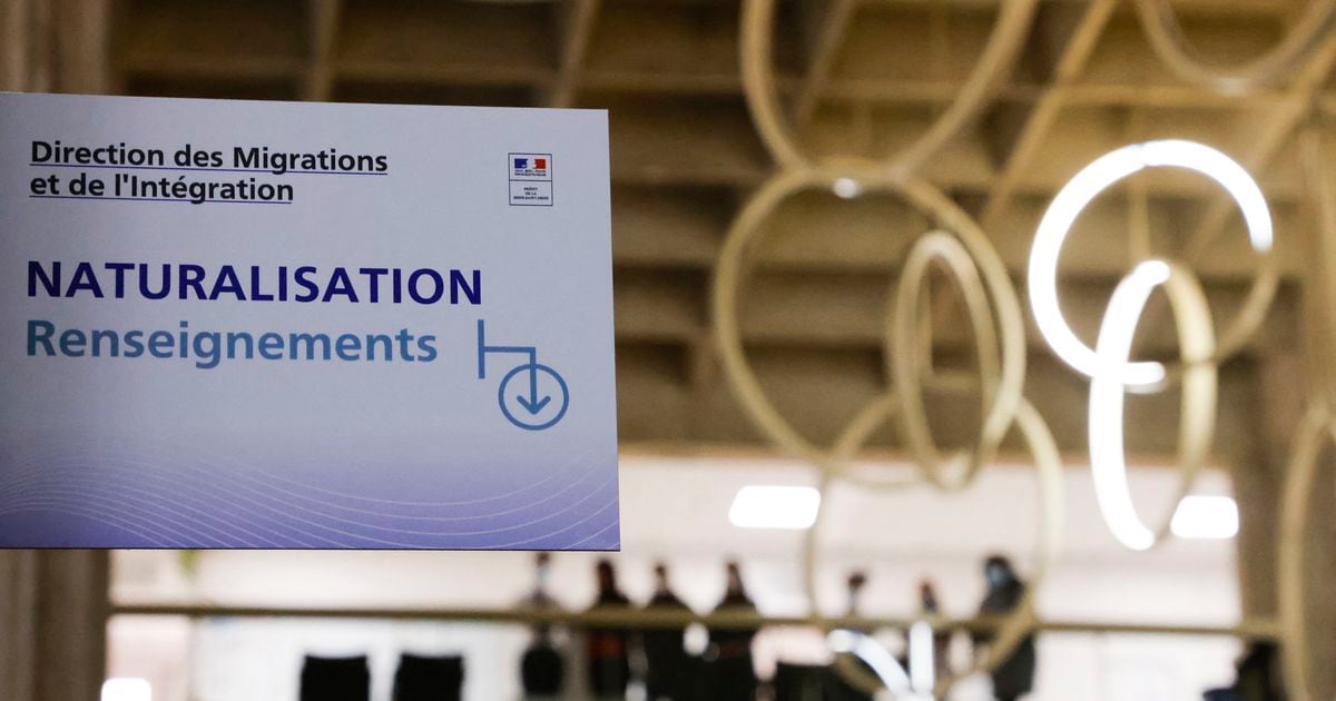 This photograph taken on October 20, 2020 shows a sign reading "naturalisation, informations" ahead of a visit of the French president about the fight against separatism at the Seine Saint Denis prefecture headquarters in Bobigny, near Paris. (Photo by Ludovic MARIN / POOL / AFP)