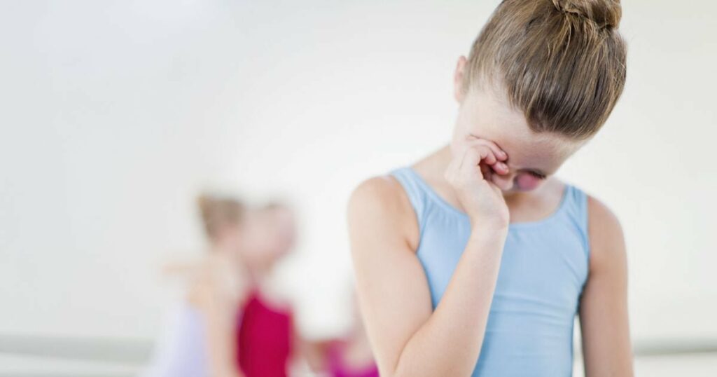 Ballet dancer wiping her eyes in studio (Photo by Hybrid Images / Cultura Creative / Cultura Creative via AFP)