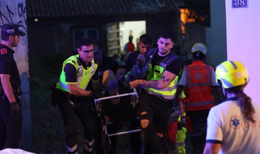 Several emergency services evacuate the injured on the beach of Palma after a building collapsed. Pic: AP