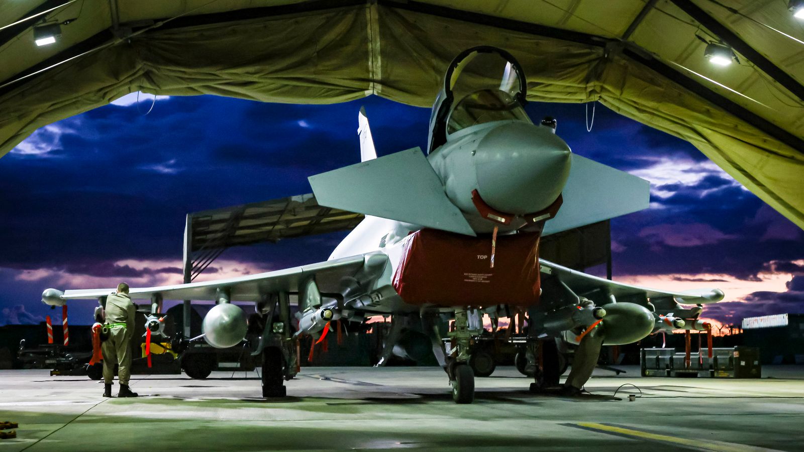 RAF Weapon Technicians prepare RAF Typhoon FRG4s aircraft to conduct further strikes against Houthi military targets in Yemen, from RAF Akrotiri, Cyprus, Saturday, Feb. 3, 2024. (AS1 Leah Jones/Ministry of Defence via AP)