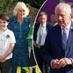 Arise, King of Compost! Charles can't contain his excitement as he gets new name from group of schoolchildren at Chelsea Flower Show - while Camilla is dubbed 'Queen of Bees'