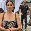 Beat the heat! Meghan Markle wears £2,275 Johanna Ortiz sundress to stave off the 95F weather while Prince Harry enjoys volleyball in Nigeria