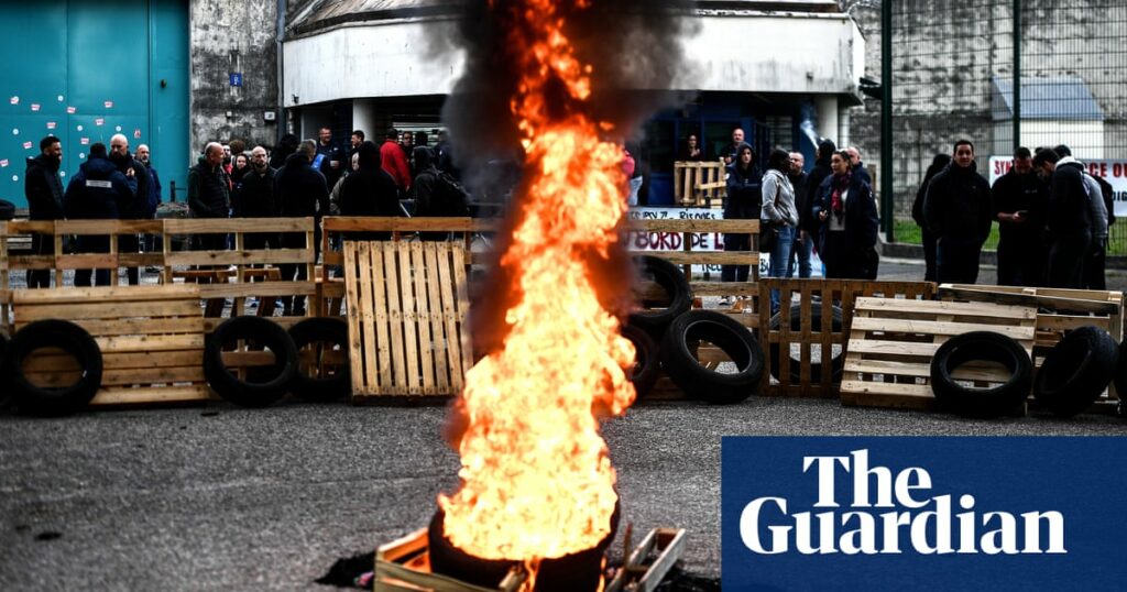 French prison officers killed in ambush named as hunt for gunmen continues