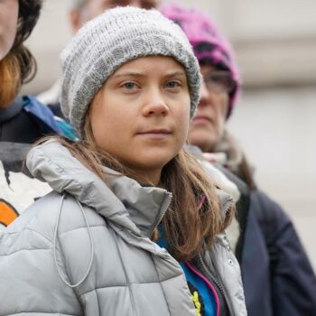 Environmental activist Greta Thunberg, centre, speaks to the media at Westminster Magistrates Court in London, Friday, Feb. 2, 2024.