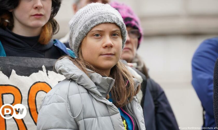 Environmental activist Greta Thunberg, centre, speaks to the media at Westminster Magistrates Court in London, Friday, Feb. 2, 2024.