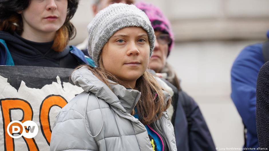 Environmental activist Greta Thunberg, centre, speaks to the media at Westminster Magistrates Court in London, Friday, Feb. 2, 2024.