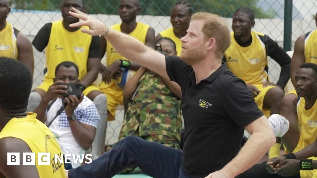 Prince Harry playing sit-down volleyball