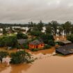 Major storms in Brazil burst hydroelectric dam as people left stranded on rooftops amid flooding