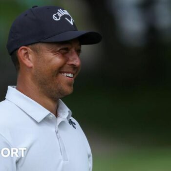 Xander Schauffele smiles while playing at the US PGA Championship