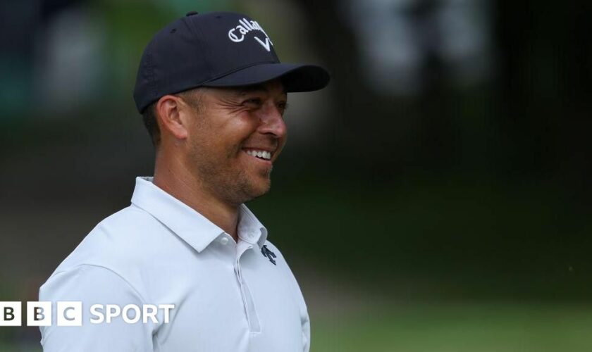 Xander Schauffele smiles while playing at the US PGA Championship