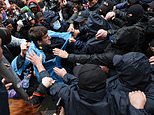 Violence breaks out outside AND inside parliament as Georgia APPROVES 'Russian law' bill that has plunged the country into crisis and pushed it closer to Putin