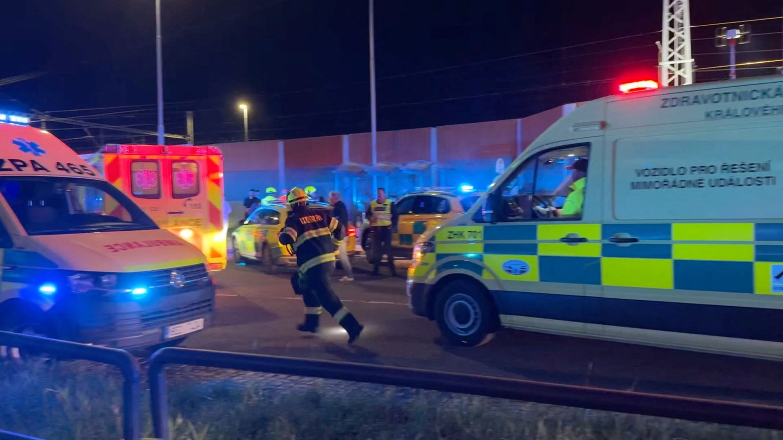 Emergency services respond to the scene following a collision between a passenger train and a freight train in Pardubice, Czech Republic. Pic: Reuters