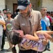 A man carries a casualty after an Israeli strike. Pic: Reuters