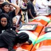 Women mourn next to the coffins of relatives who died in the Ethiopian Airlines crash