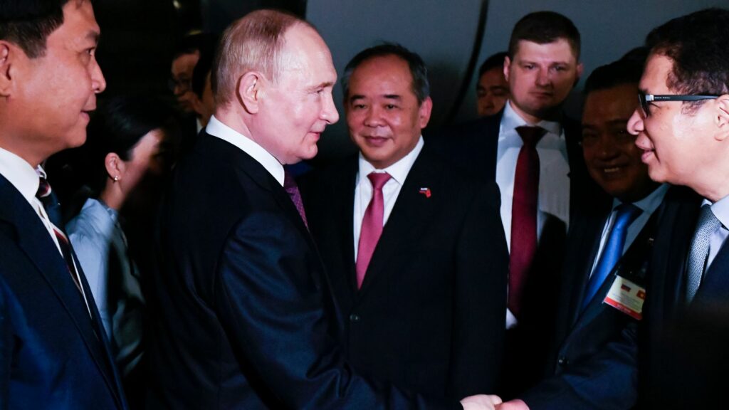 Vladimir Putin is greeted by Vietnamese officials on his arrival in Hanoi Pic: AP