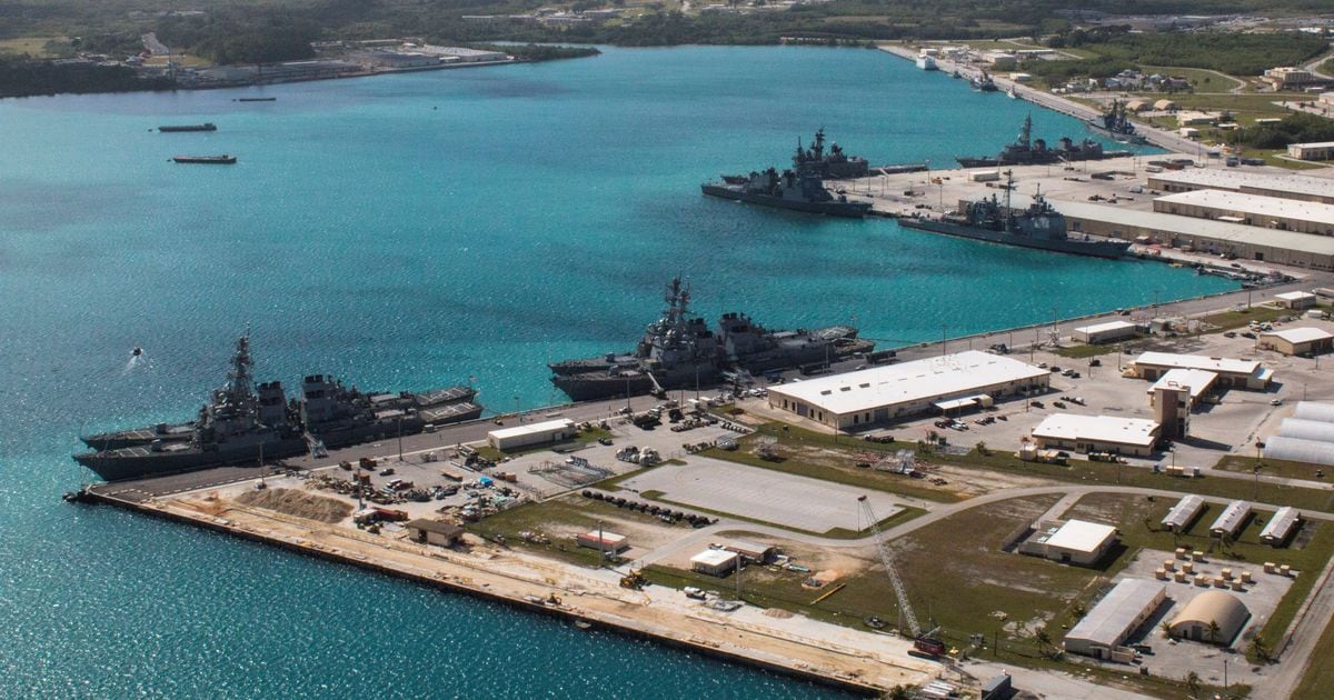 FILE PHOTO: Navy vessels are moored in port at the U.S. Naval Base Guam at Apra Harbor, Guam March 5, 2016.  Major Jeff Landis,USMC (Ret.)/Naval Base Guam/Handout/File Photo via REUTERS. ATTENTION EDITORS - THIS IMAGE WAS PROVIDED BY A THIRD PARTY - RTS1AYM8