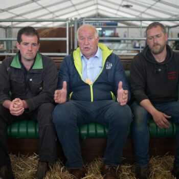 Dairy farmer Ray Brown (centre) with colleagues