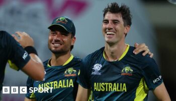 Australia's Pat Cummins and Marcus Stoinis celebrate a wicket against Bangladesh at 2024 T20 World Cup