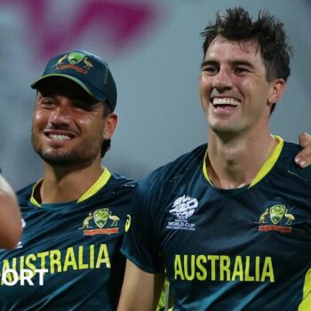 Australia's Pat Cummins and Marcus Stoinis celebrate a wicket against Bangladesh at 2024 T20 World Cup