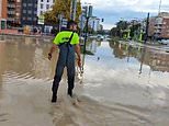 Emergency crews in Spain's Murcia region launch operation to rescue people trapped in their cars as floods hit area popular with British holidaymakers causing chaos with roads blocked and homes ruined