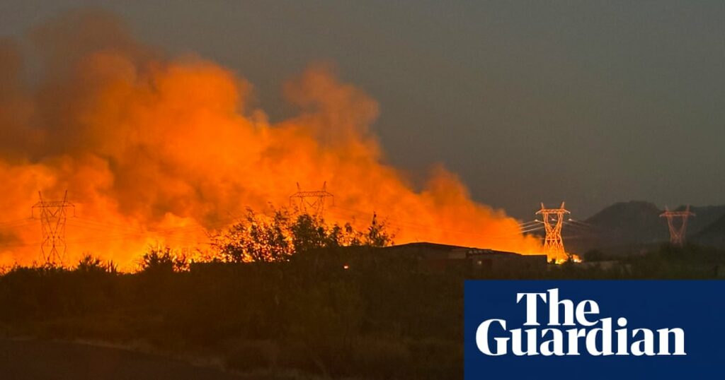 Firefighters near Phoenix battle wildfire as temperatures surpass 100F