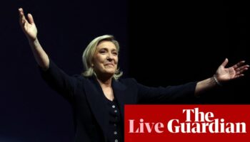 France election live: exit poll puts far-right National Rally ahead