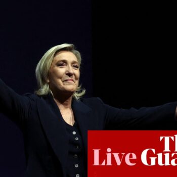 France election live: exit poll puts far-right National Rally ahead