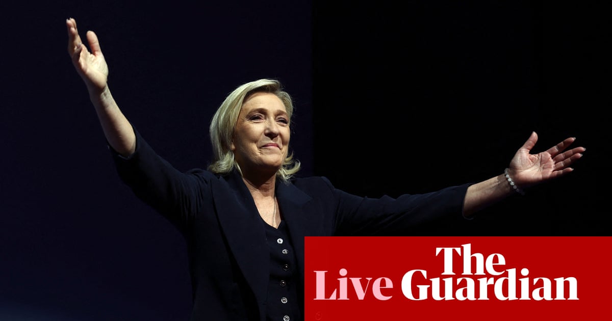 France election live: exit poll puts far-right National Rally ahead