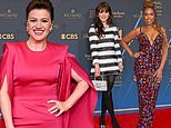 Kelly Clarkson proudly shows off her slimmed-down figure in a fitted pink gown with stylish Zooey Deschanel and Jennifer Hudson as they lead stars at 51st Daytime Emmy Awards in LA
