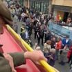 Nigel Farage is pelted with wet cement and coffee cup by attacker as he campaigns for Reform Party on open top bus in Barnsley