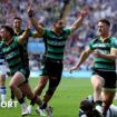 Northampton players raise their arms in celebration after the final whistle is blown