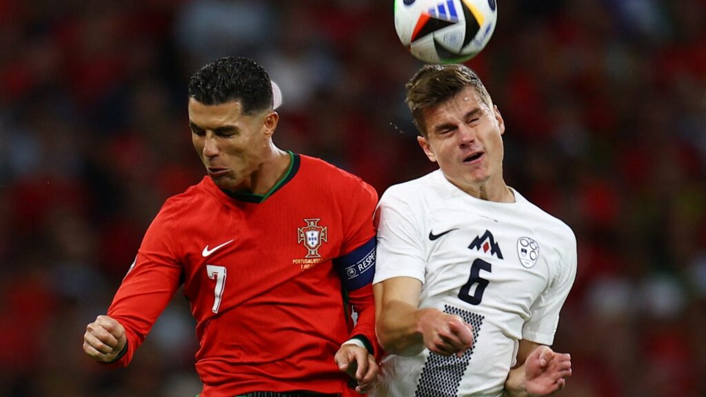 Soccer Football - Euro 2024 - Round of 16 - Portugal v Slovenia - Frankfurt Arena, Frankfurt, Germany - July 1, 2024 Portugal's Cristiano Ronaldo in action with Slovenia's Jaka Bijol REUTERS/Lee Smith