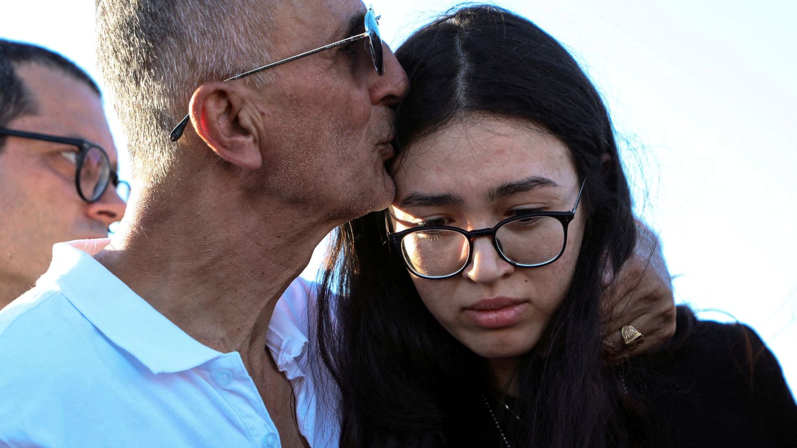 Noa and her father during the funeral in Beersheba. Pic: Reuters